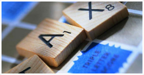 Scrabble Pieces Spelling "Tax"