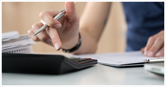 Woman Using Calculator